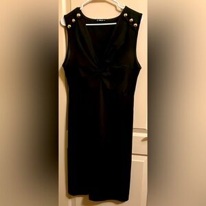 Olive green sleeveless fitted dress, gold shoulder buttons.